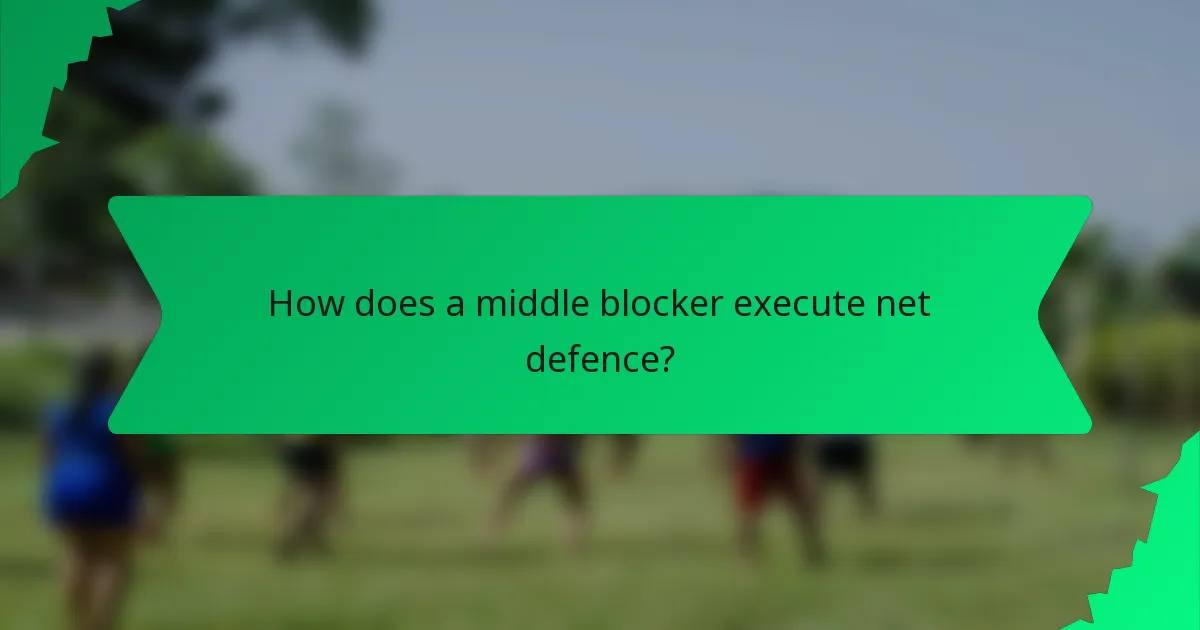 How does a middle blocker execute net defence?
